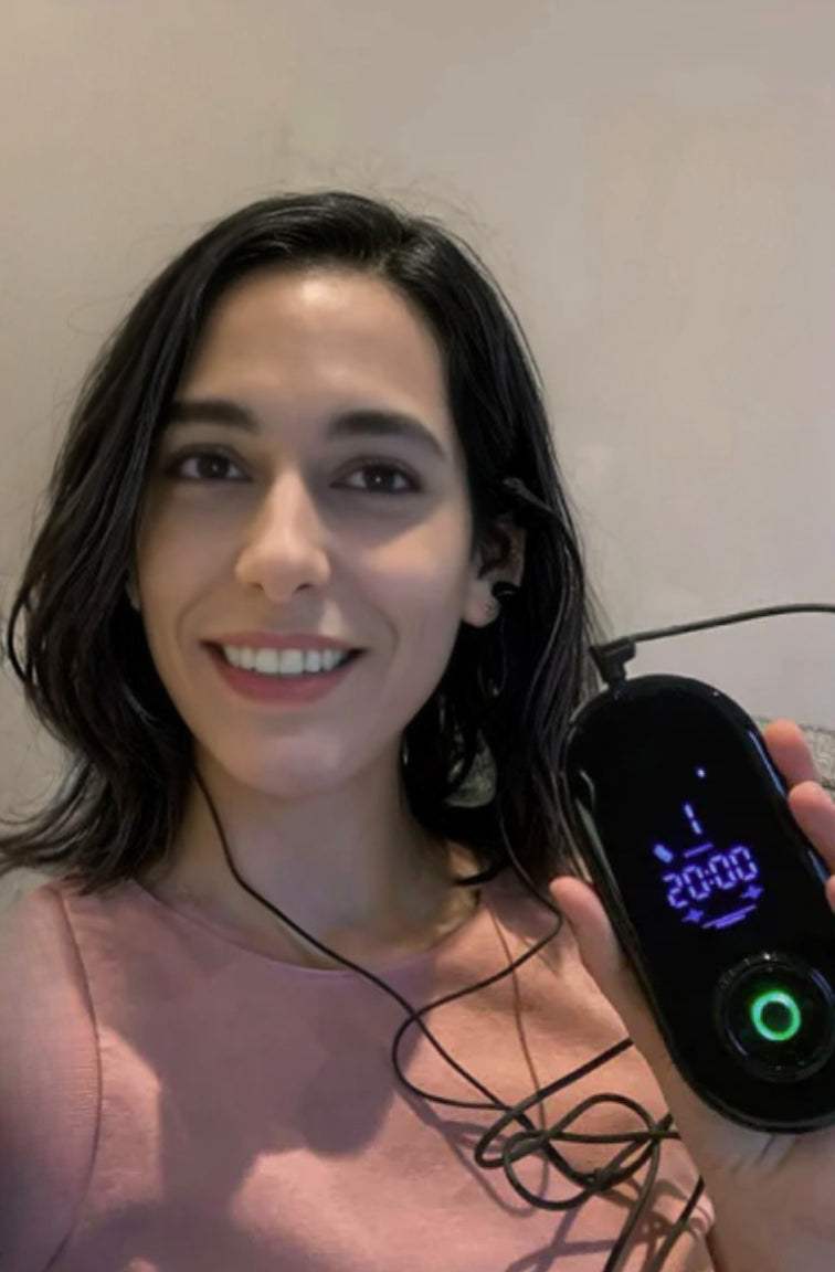 NeuroRest-Woman holding a digital device with a timer on a plain background
